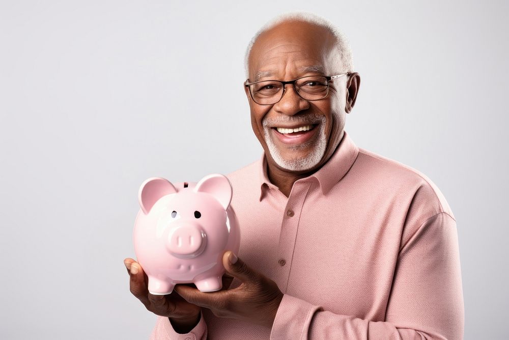 Man holding his piggy bank glasses adult smile.