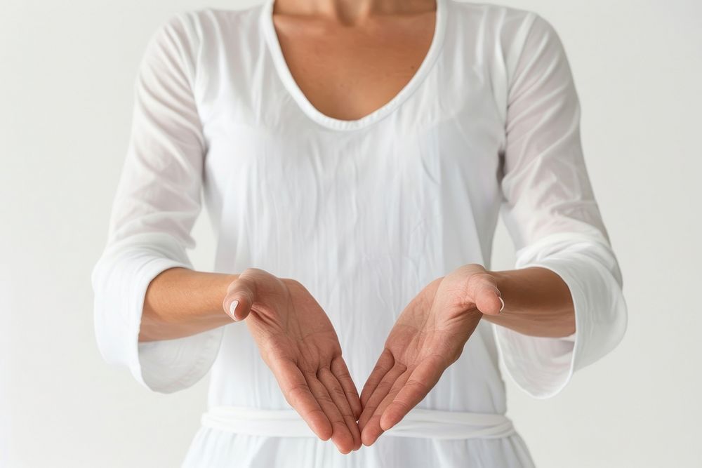 Woman joining hands sleeve blouse cross-legged.