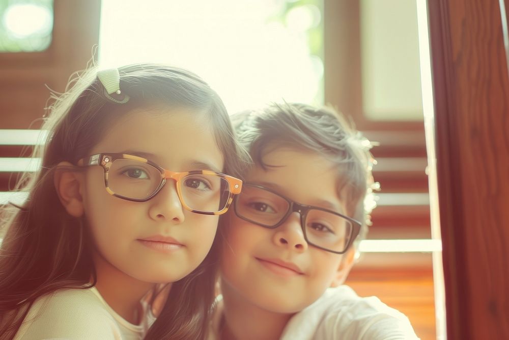 Two kids wearing glasses portrait child photo.