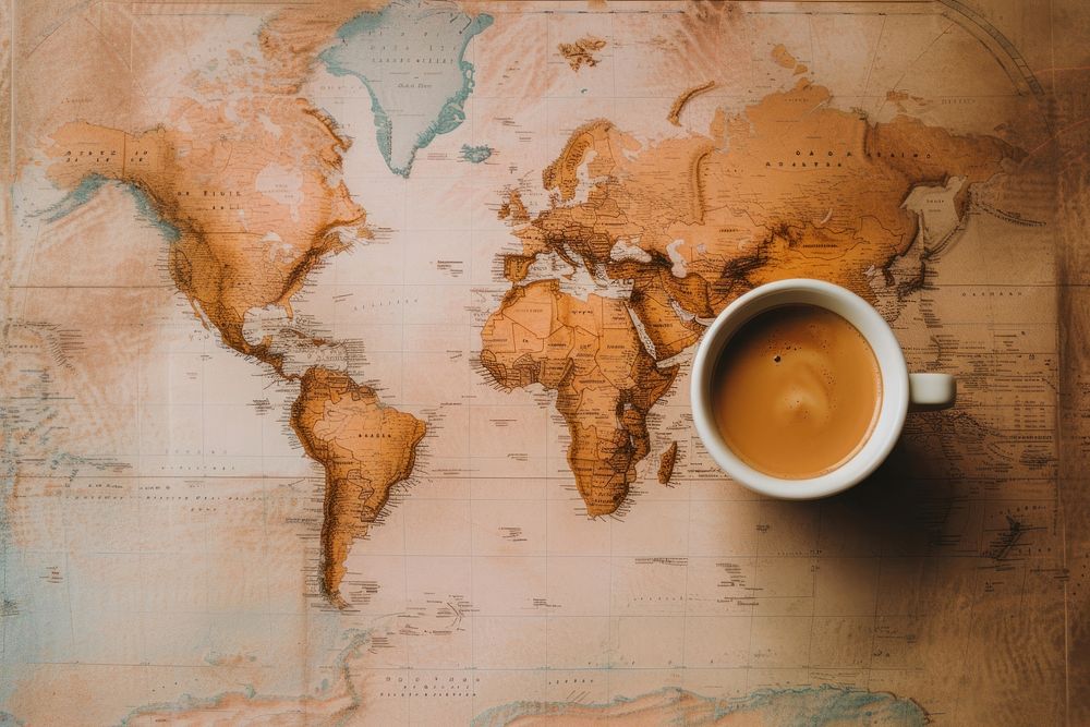Coffee cup on world map drink mug refreshment.