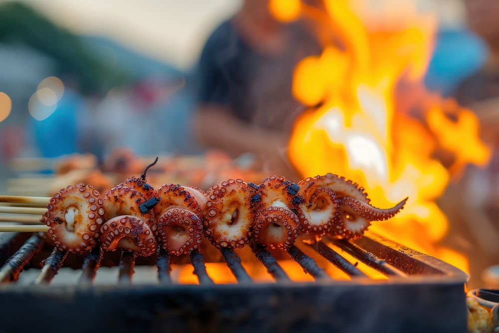 Octopus grill on stick grilling seafood cooking.