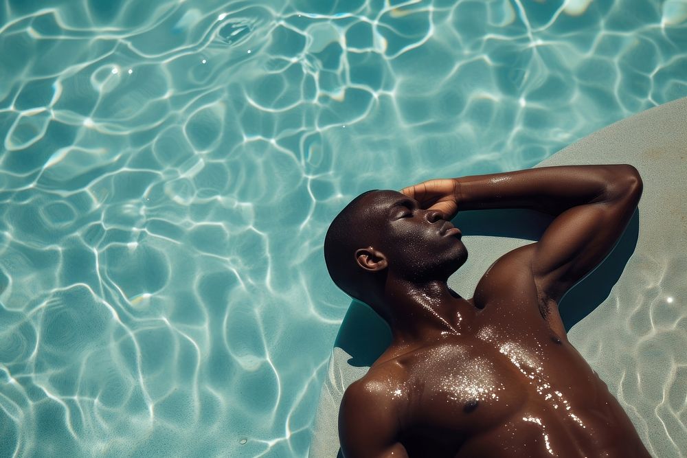 African american man sunbathing adult pool bodybuilding.