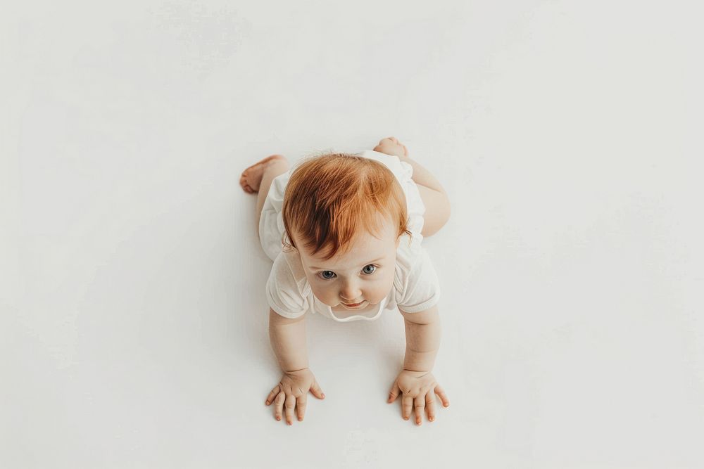 Baby girl crawling photo white background.