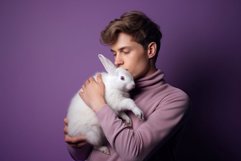 Person hugging a rabbit animal mammal adult.