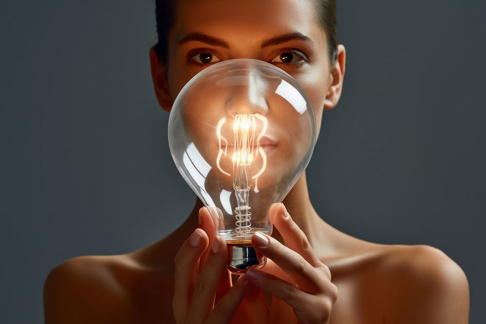 Person holding light bulb lightbulb adult electricity.
