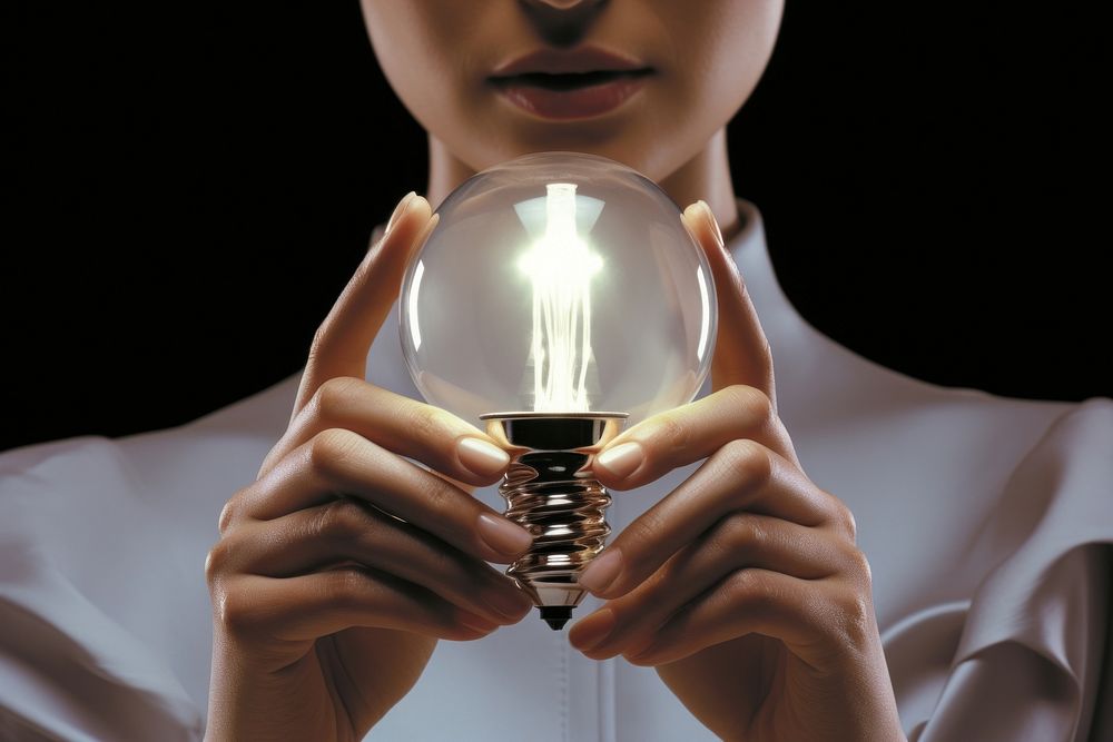 Person holding light bulb lightbulb hand electricity.