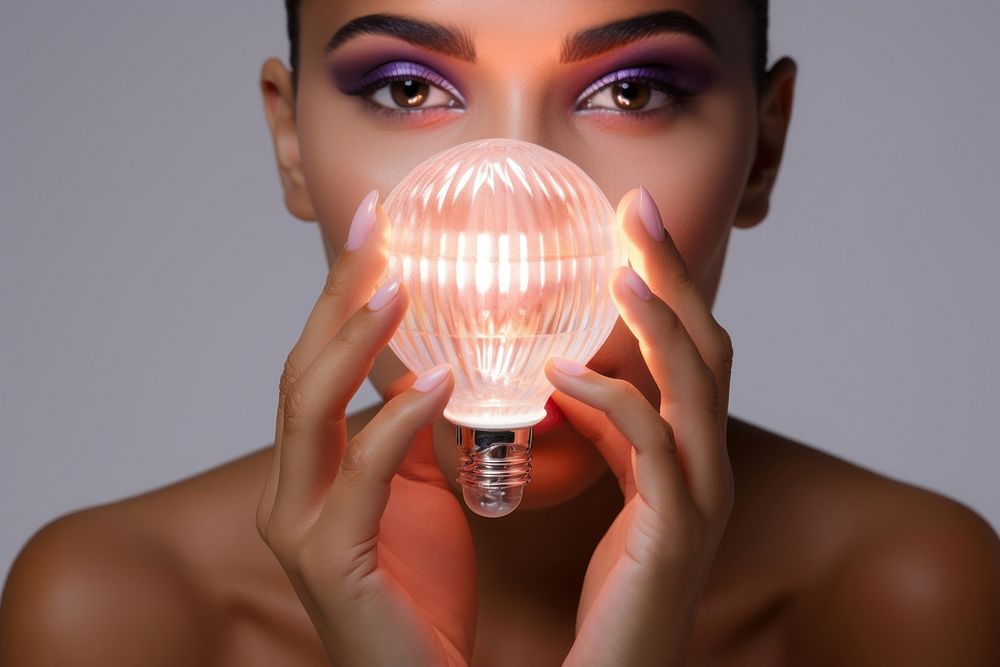 Person holding light bulb photography lightbulb portrait.