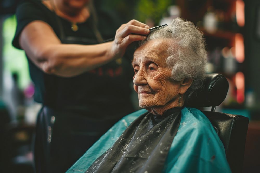 Elderly woman getting a haircut in barber barbershop adult hairdresser.