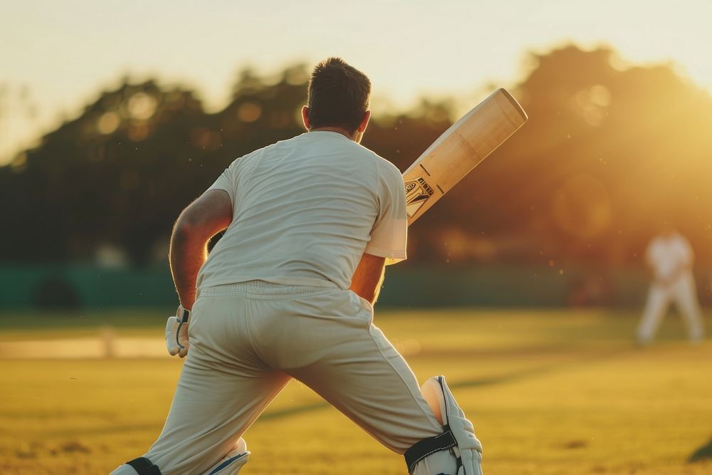 Man playing cricket outdoors sports player.