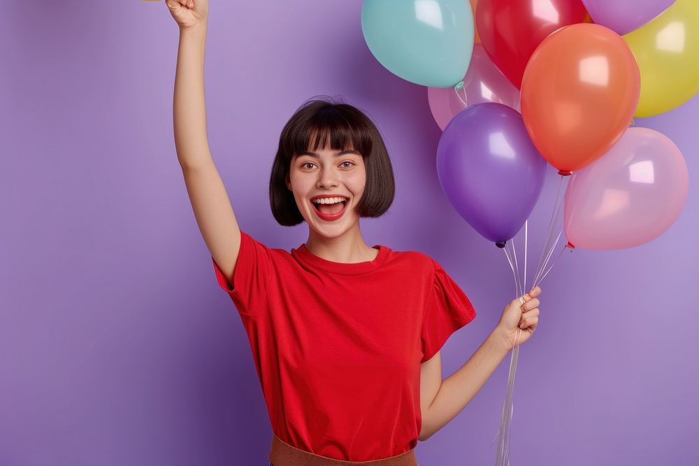 Very happy young woman balloon holding purple.