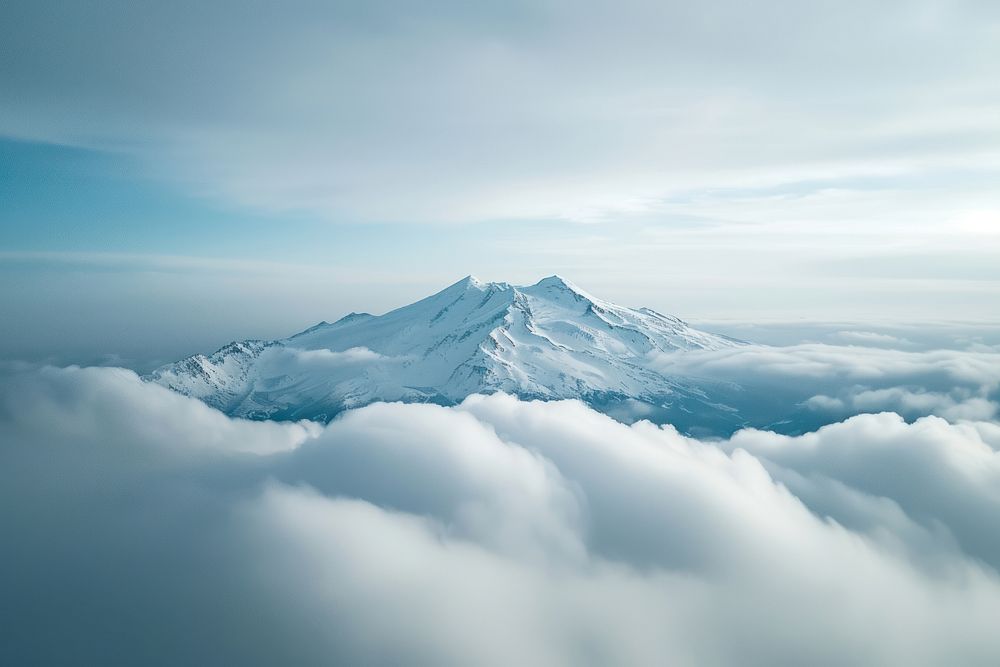 Photo of snowy mountain peek through cloud landscape outdoors nature.
