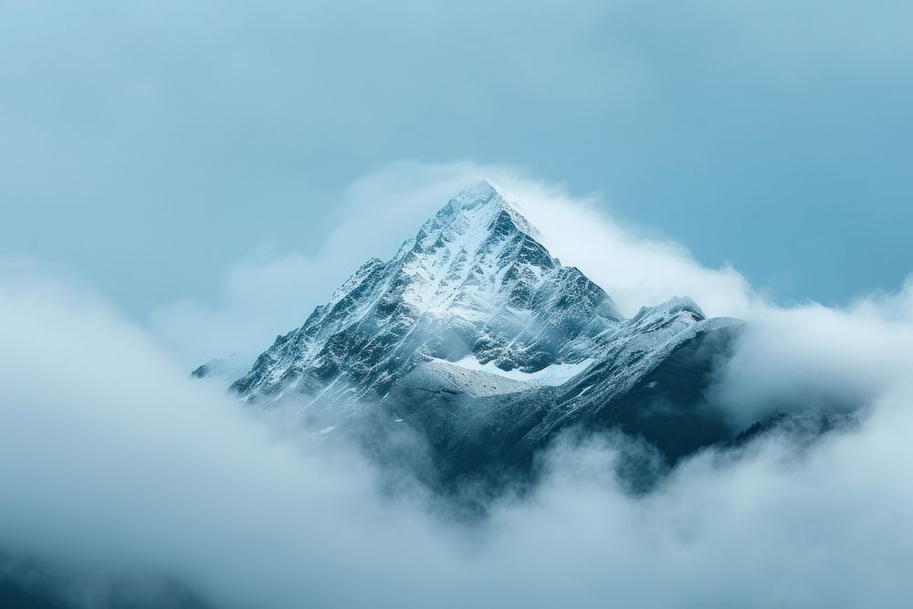 Photo of snowy mountain peek through cloud outdoors nature stratovolcano.