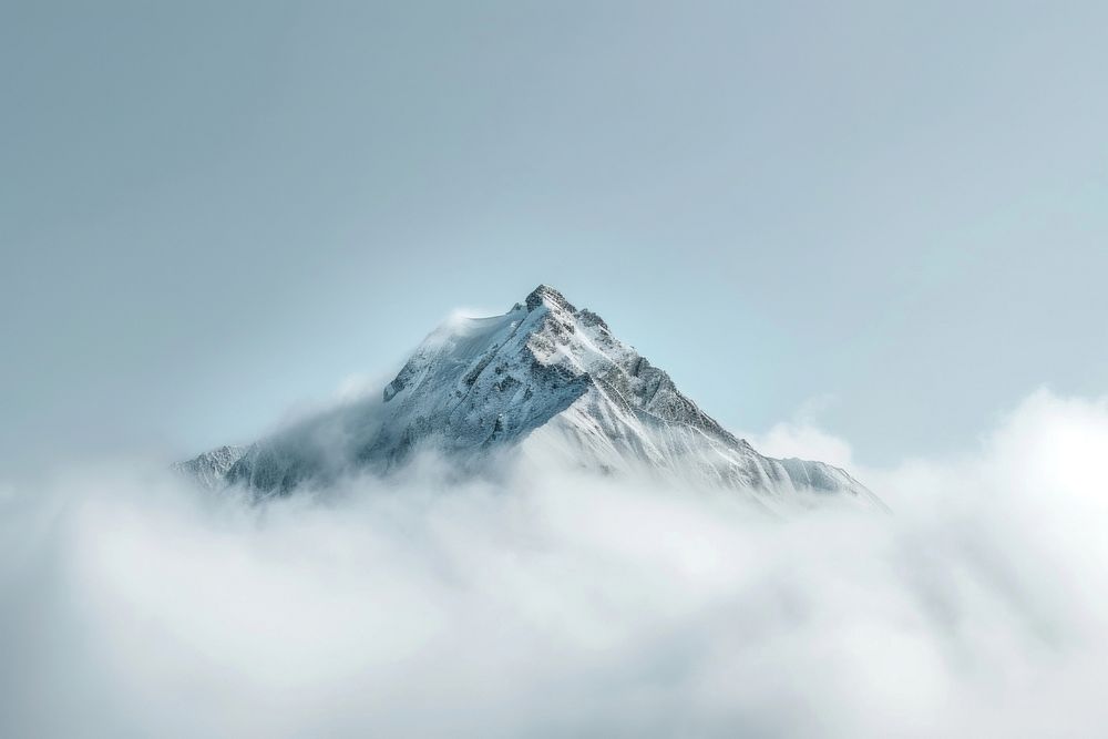 Photo of snowy mountain peek through cloud outdoors nature sky.