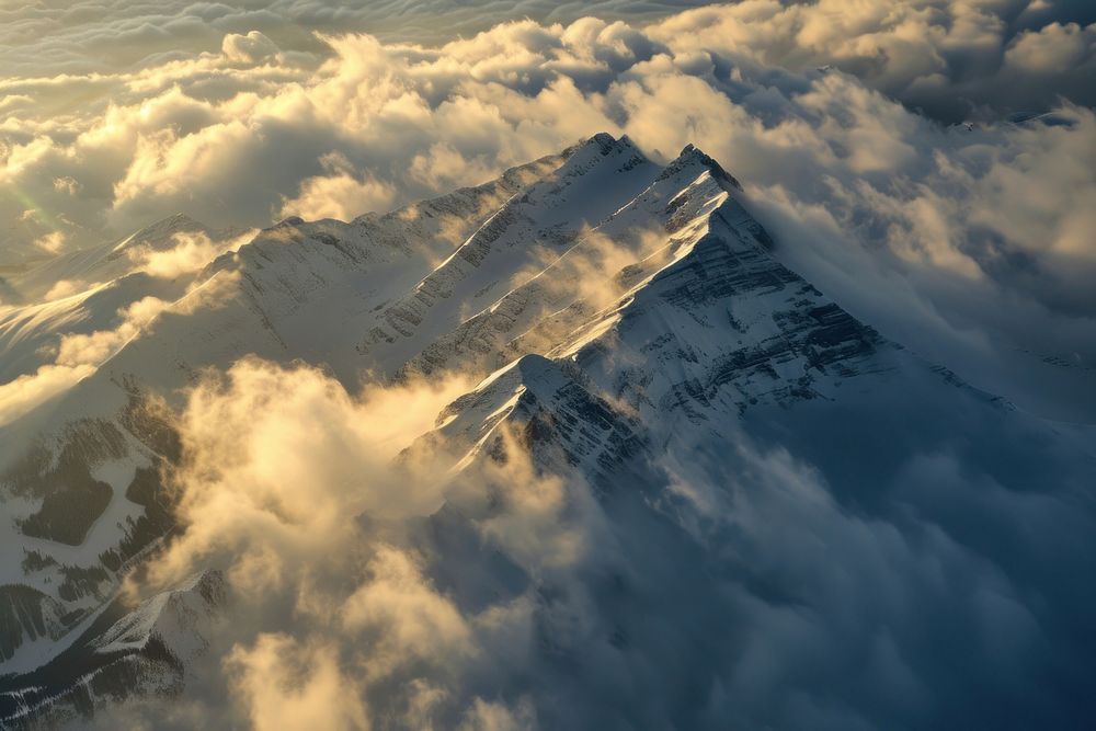 Photo of snowy mountain peek through cloud outdoors nature sky.