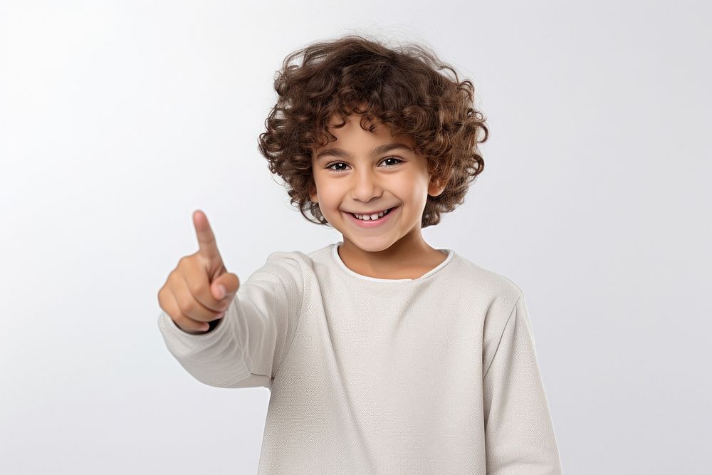 Young kid boy with pointing smile portrait photo.