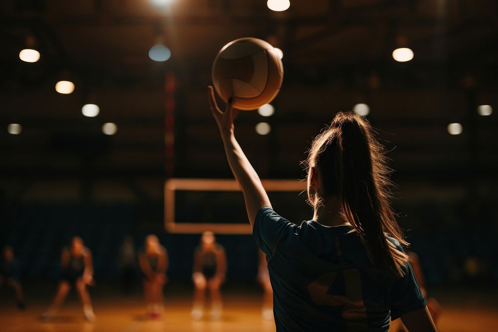 Woman serving a volleyball adult basketball sports.