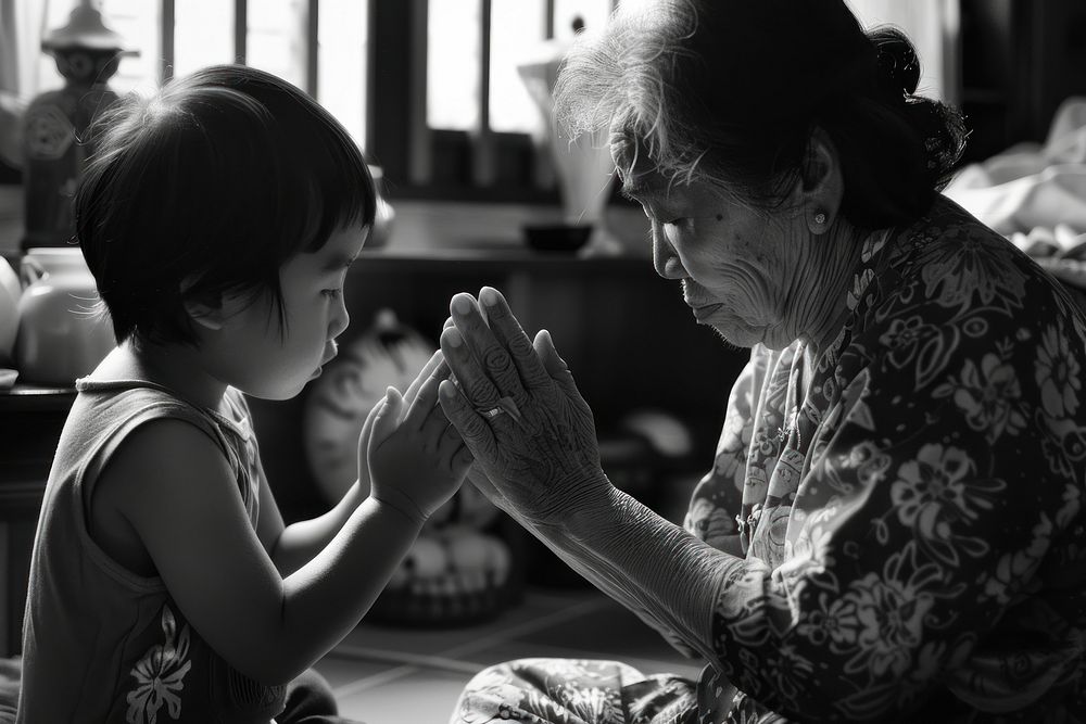 Praying grandmother adult togetherness.