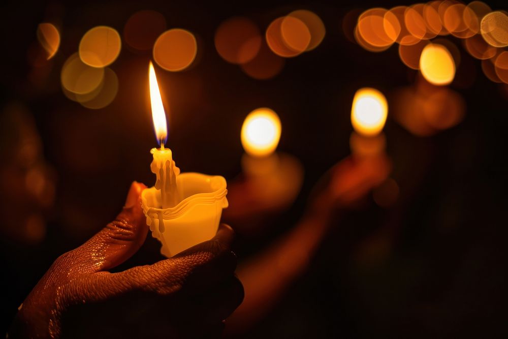 People holding candle darkness spirituality illuminated.