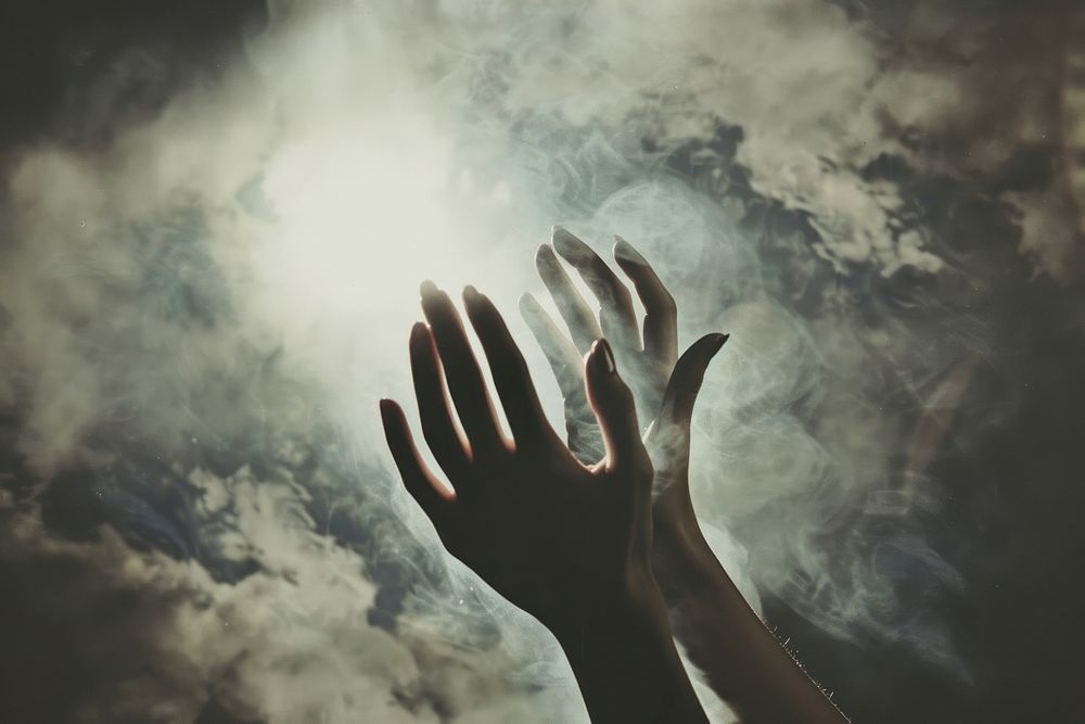 Praying hand nature sky.