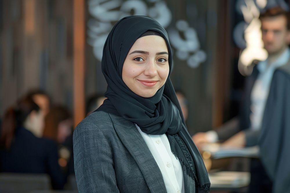Muslim woman stand and smile against business people meeting adult scarf headscarf.