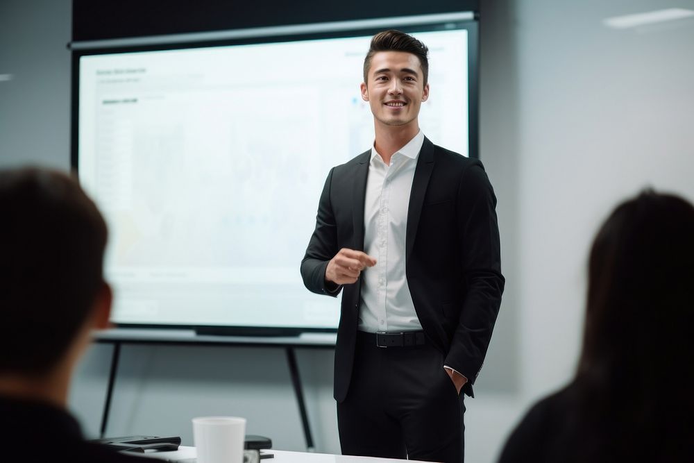 Asian office worker screen standing meeting.