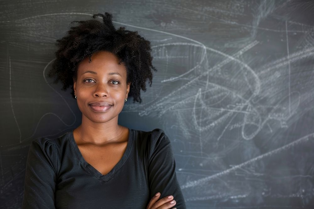 Black woman teacher cross arm against black board blackboard smile adult.