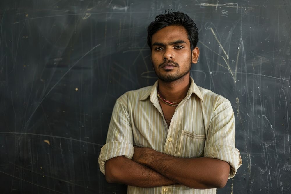 Indian man teacher cross arm against black board blackboard portrait adult.