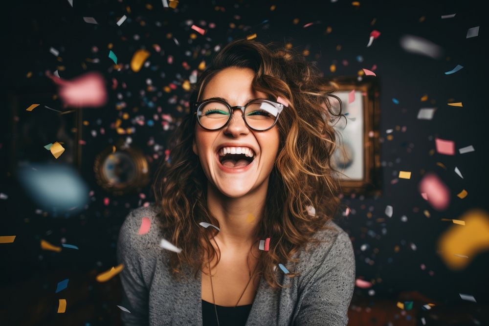 Woman enjoying cheerful confetti laughing glasses.