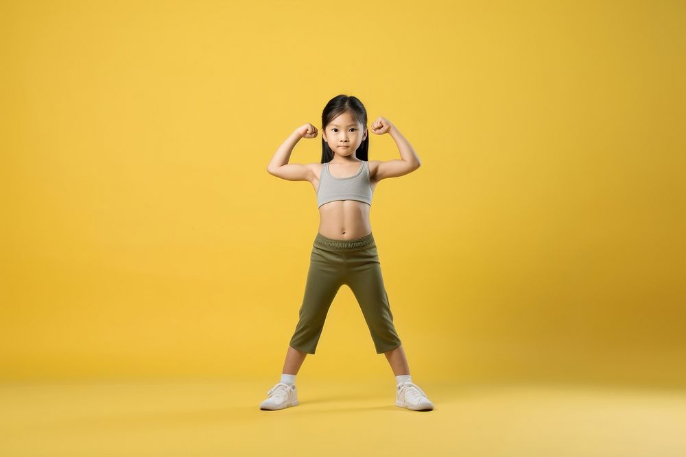Asian little girl stretching portrait dancing.
