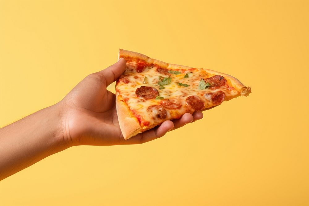 Hand holding pizza food freshness cheese.