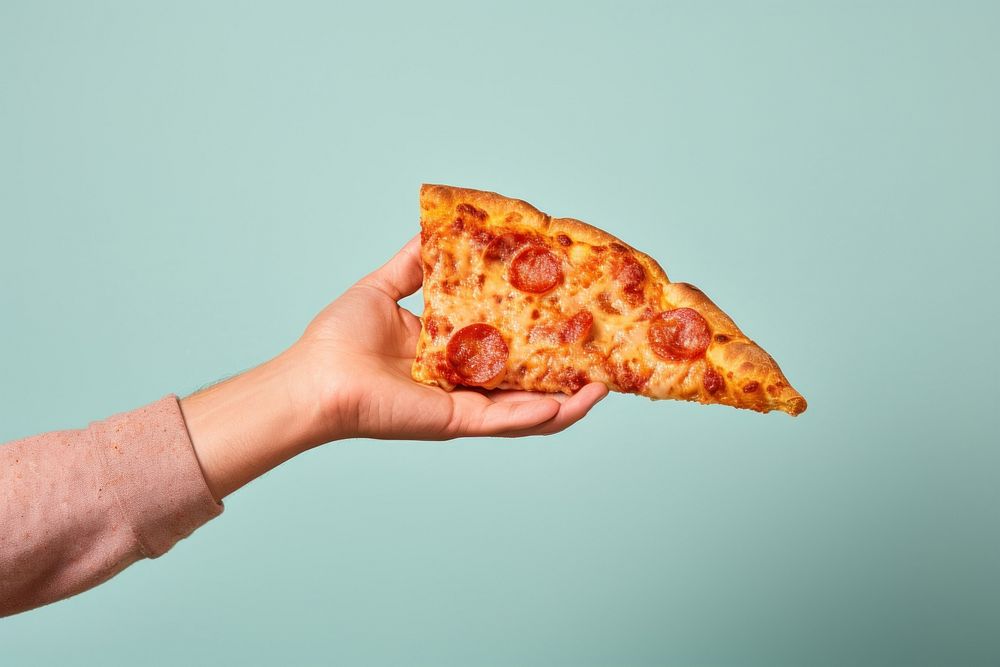 Hand holding pizza food pepperoni freshness.