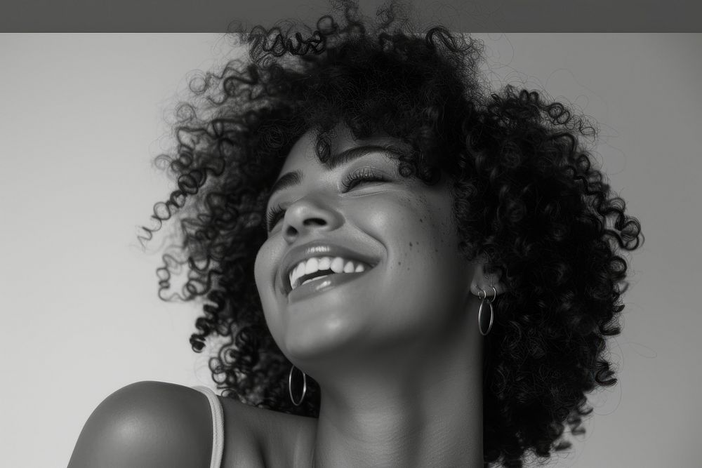 Woman with curly hair smiling portrait laughing adult.