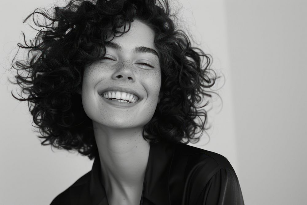 Woman with curly hair smiling portrait adult smile.