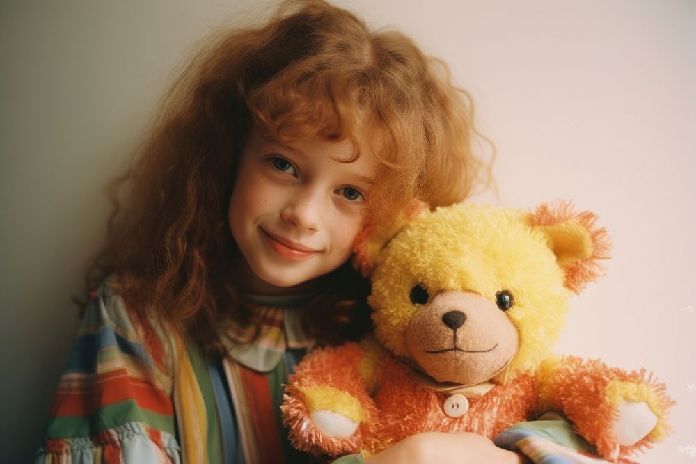 Light baby girl holding teddy bear face photography portrait child.