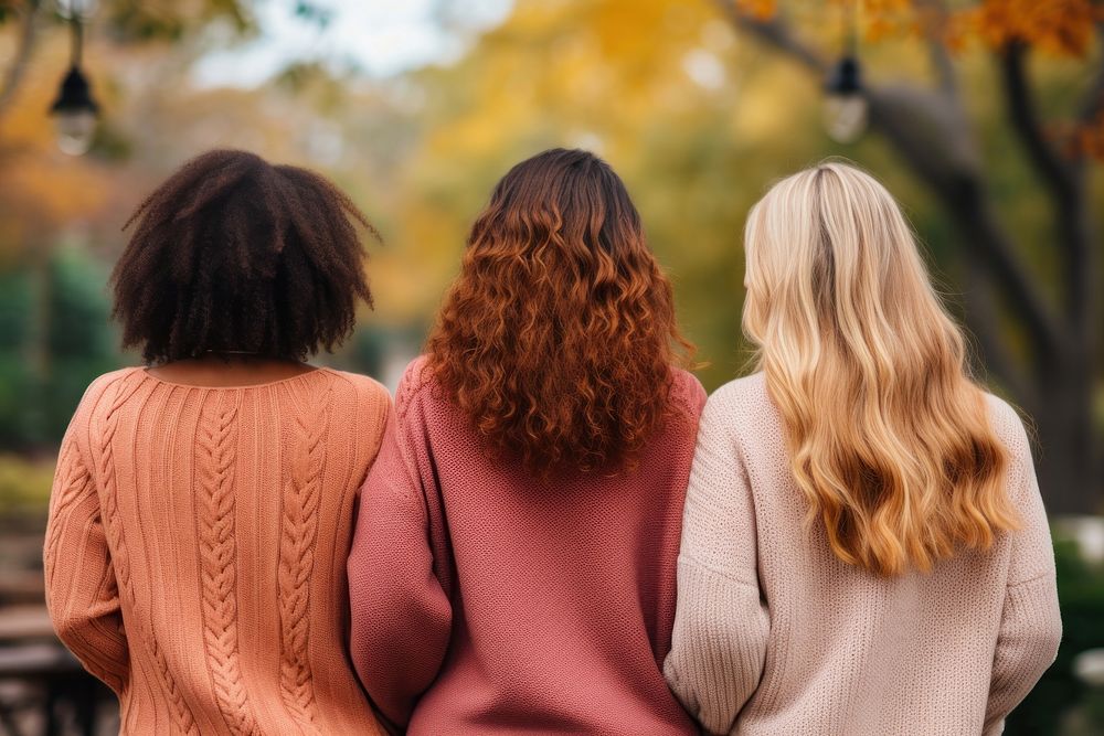 Three diverse woman community sweater adult back.