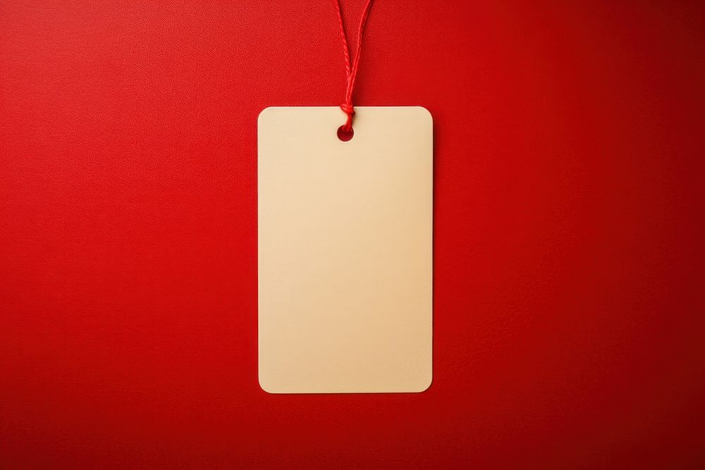 Blank paper label tag backgrounds text red.