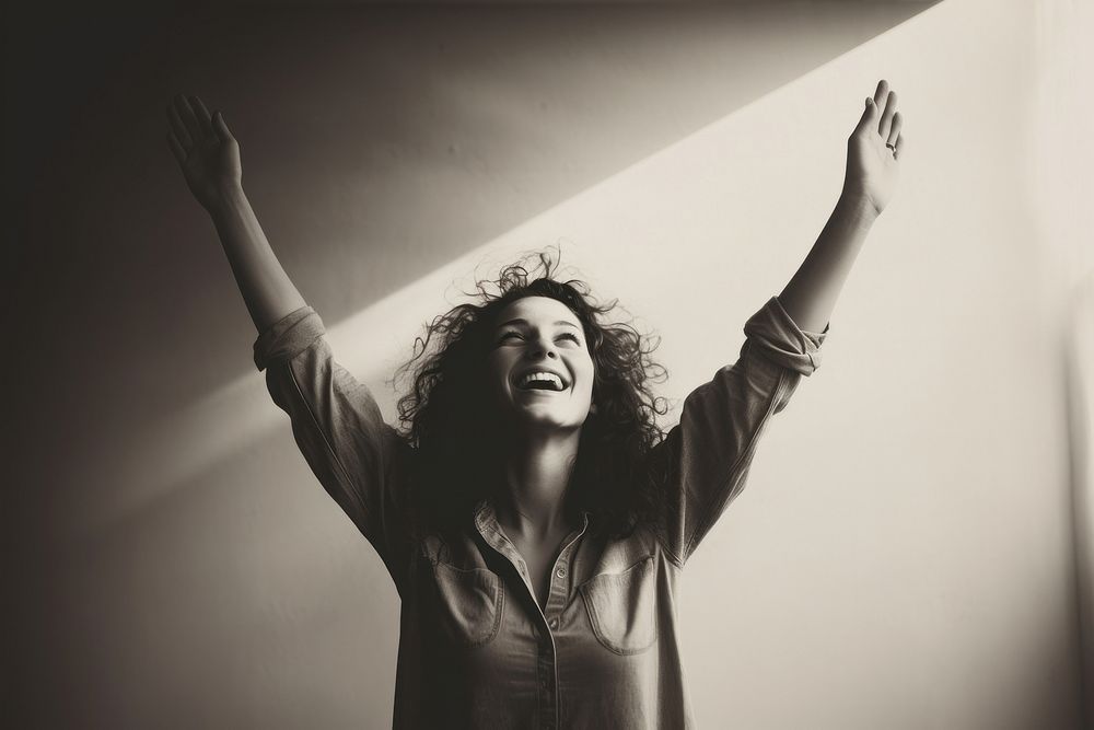Woman raising hands smiling laughing smile adult.