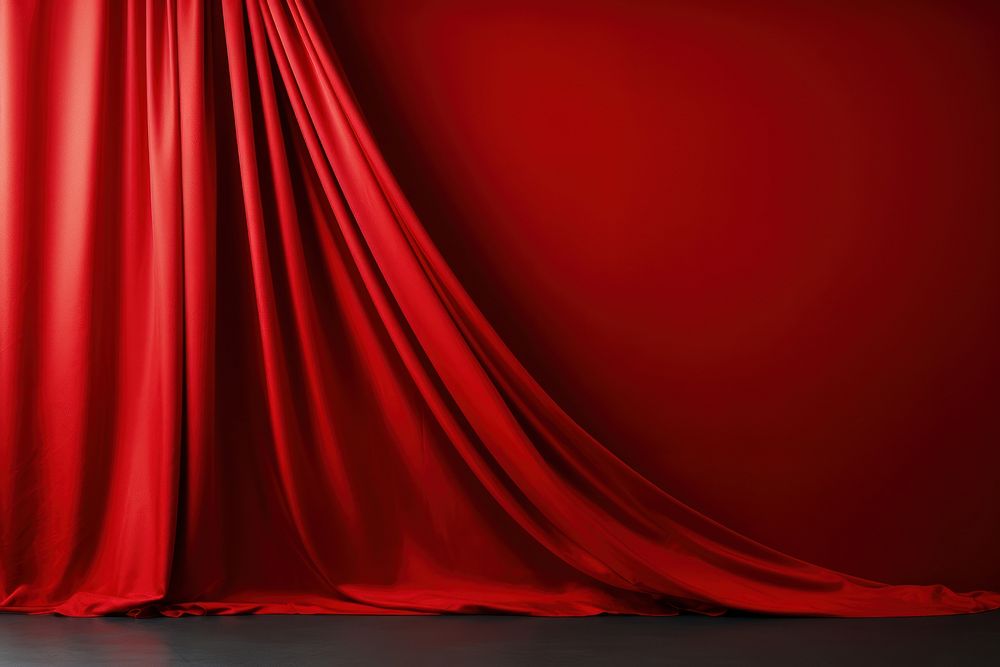 Dark rednsilk fabric curtain backgrounds copy space elegance.