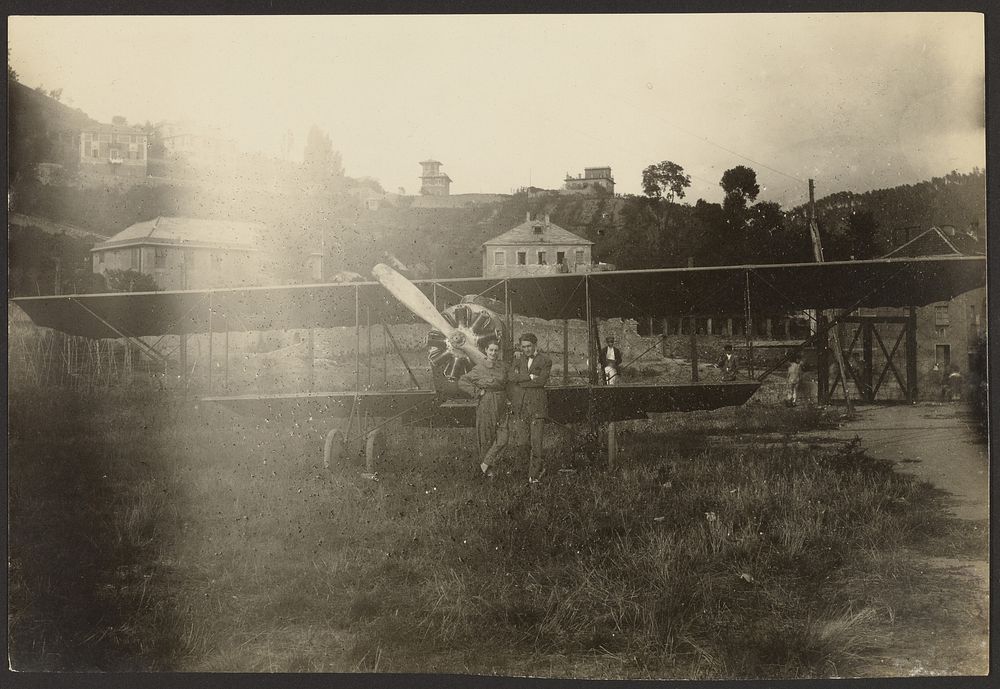 Portrait of couple in front of airplane by Fédèle Azari