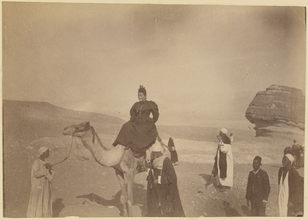 Woman riding a camel