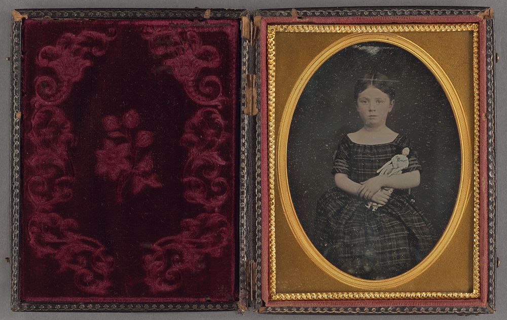 Portrait of a Little Girl Holding a Doll