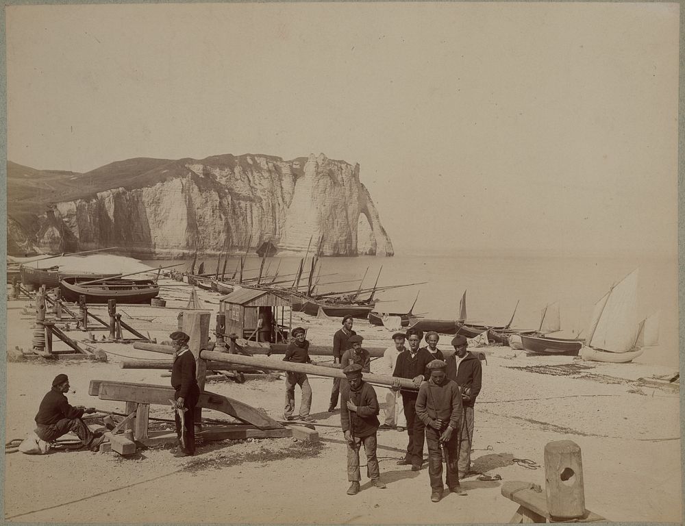 Workers on beach at Étretat