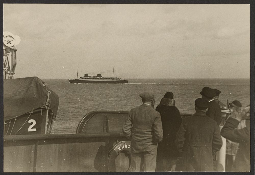 Group of People on the Deck of a Ship Watching Another Ship Sailing Pass in the Distance by Erich Salomon