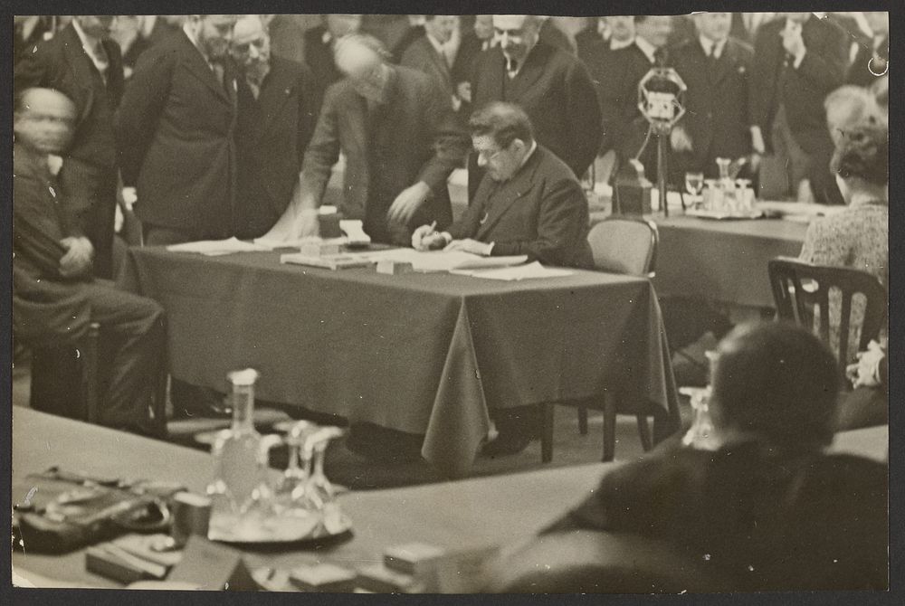 Man Signing a Document at a Banquet by Erich Salomon
