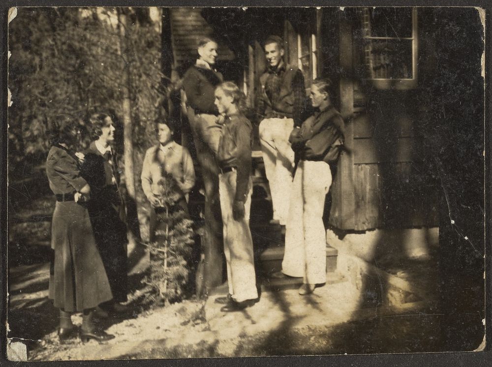 Group Standing Behind House by Louis Fleckenstein