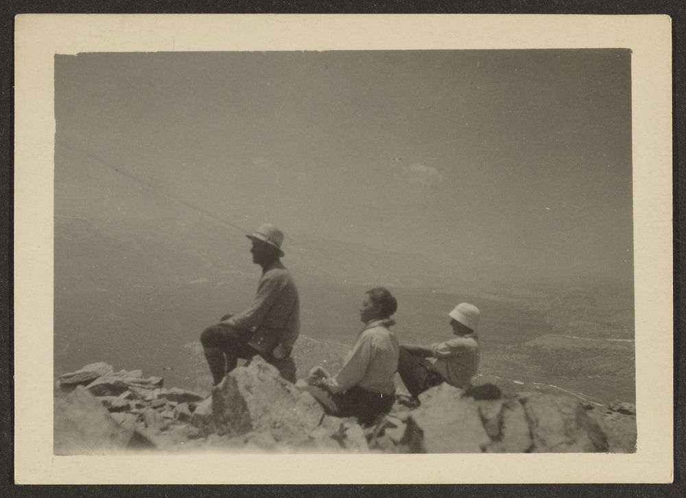 Hikers Seated on Rocks by Louis Fleckenstein