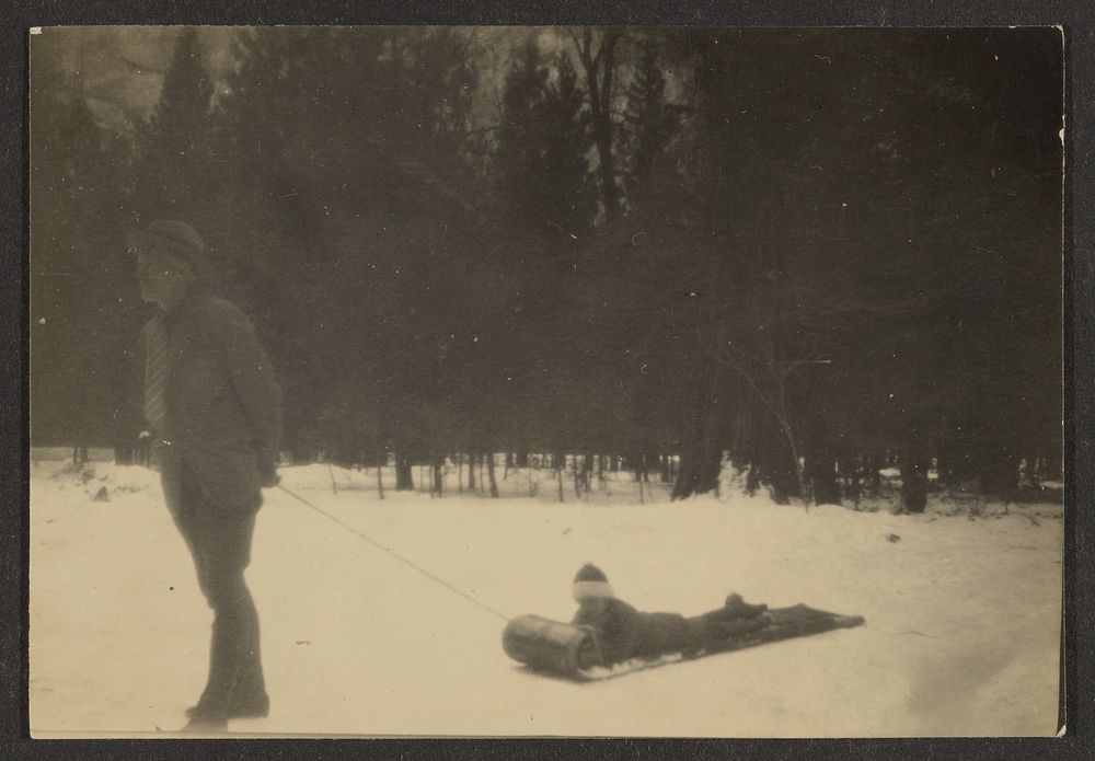 Man Pulling Child on Sled in Snow by Louis Fleckenstein