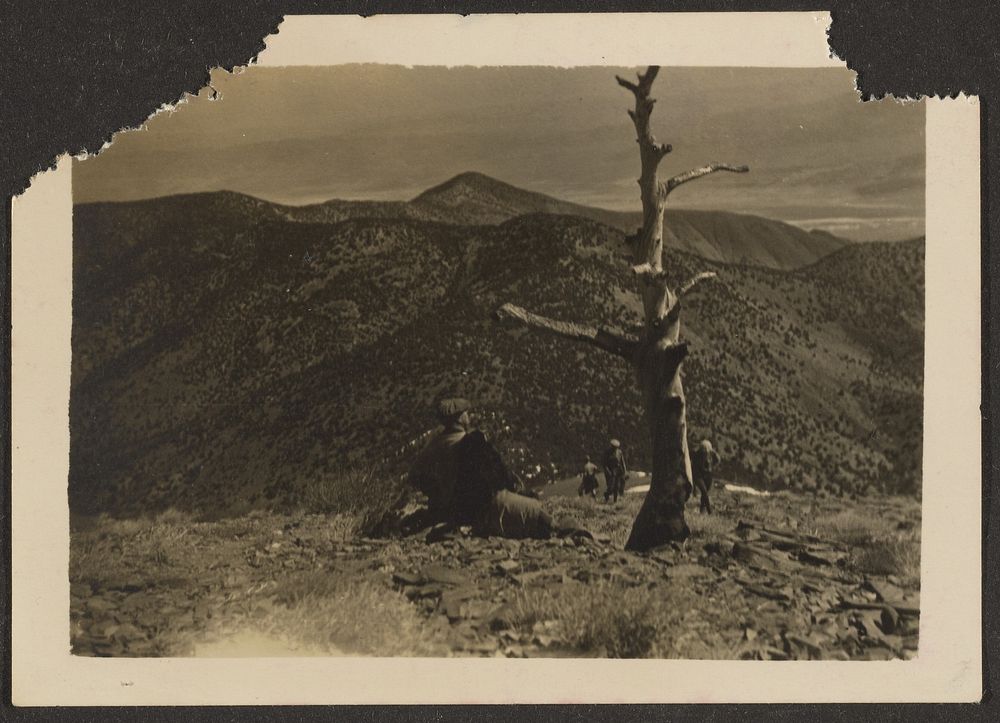 Hiker Seated on Mountain Top by Louis Fleckenstein