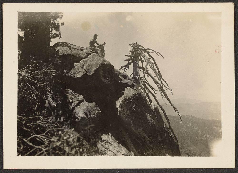 Hiker Seated on Boulder by Louis Fleckenstein
