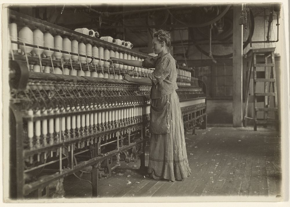 In an Old-Fashioned Textile Mill (Spinner). by Lewis W Hine